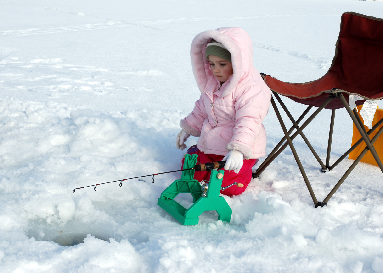 Little Girl ice fishing for the first time
